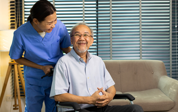 Asian Nurse take care Elderly Senior Man with warm welcome. 70s